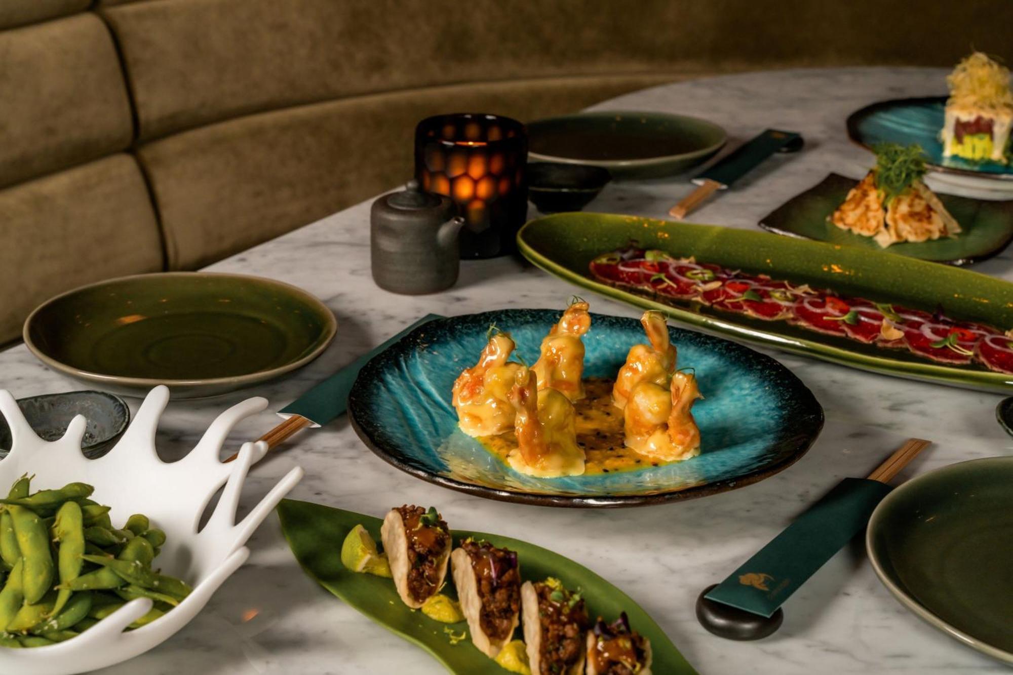 The Dubai Edition Экстерьер фото A selection of dishes at the restaurant