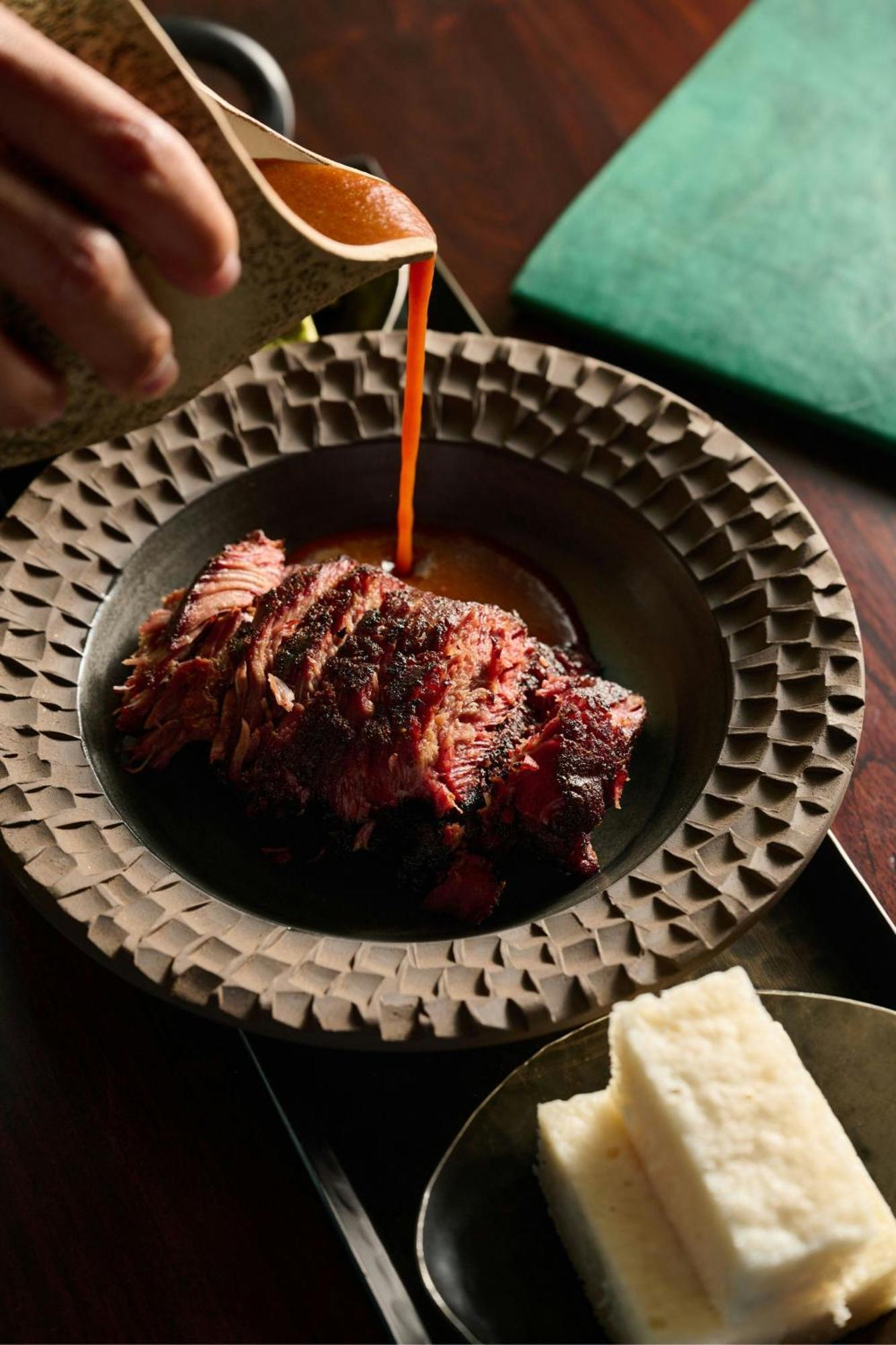 The Dubai Edition Экстерьер фото A plate of grilled meat
